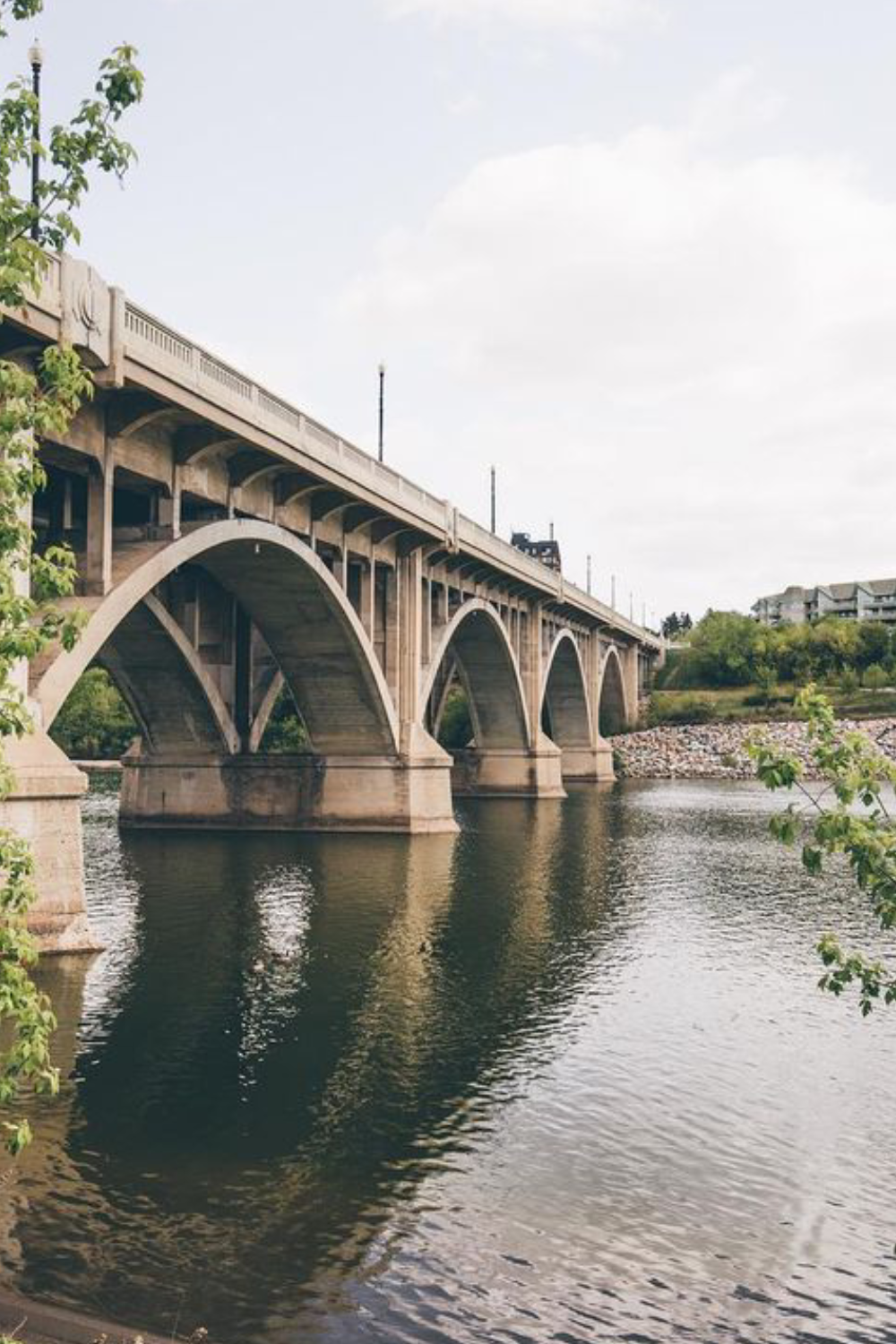 A men in a suite looking at other men with a smile